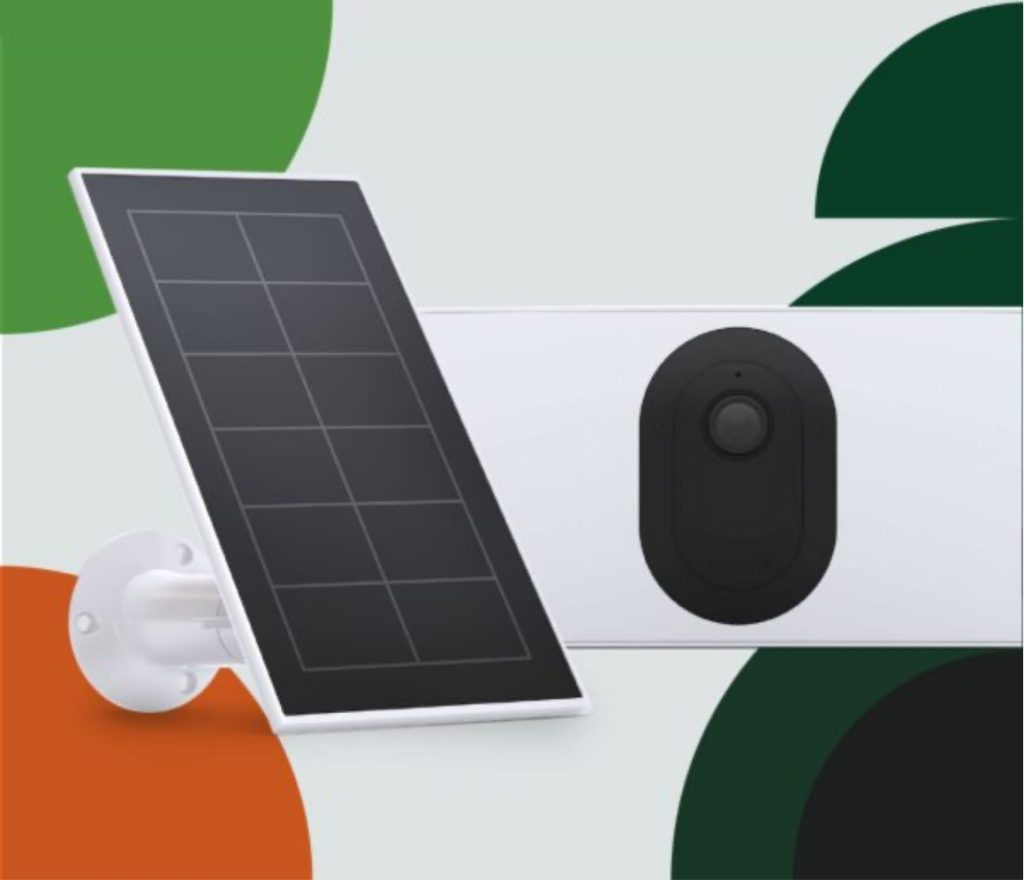 A security camera with a solar panel in front of it\.